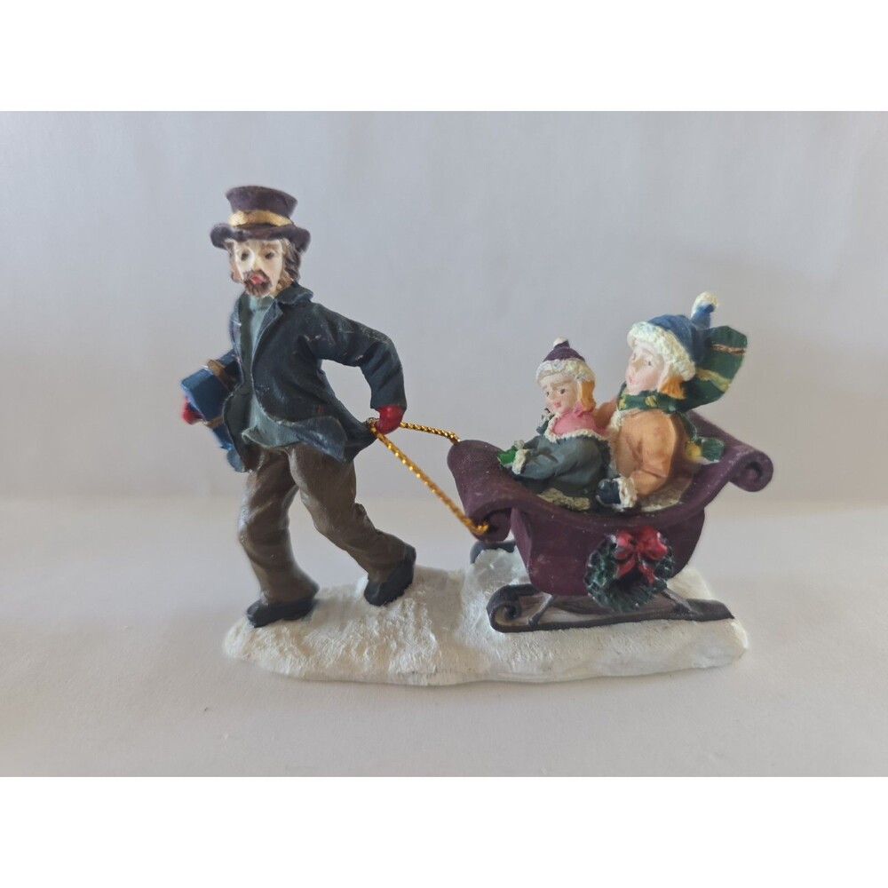 Home Accents Holiday Christmas Resin Figurine: pulling sled